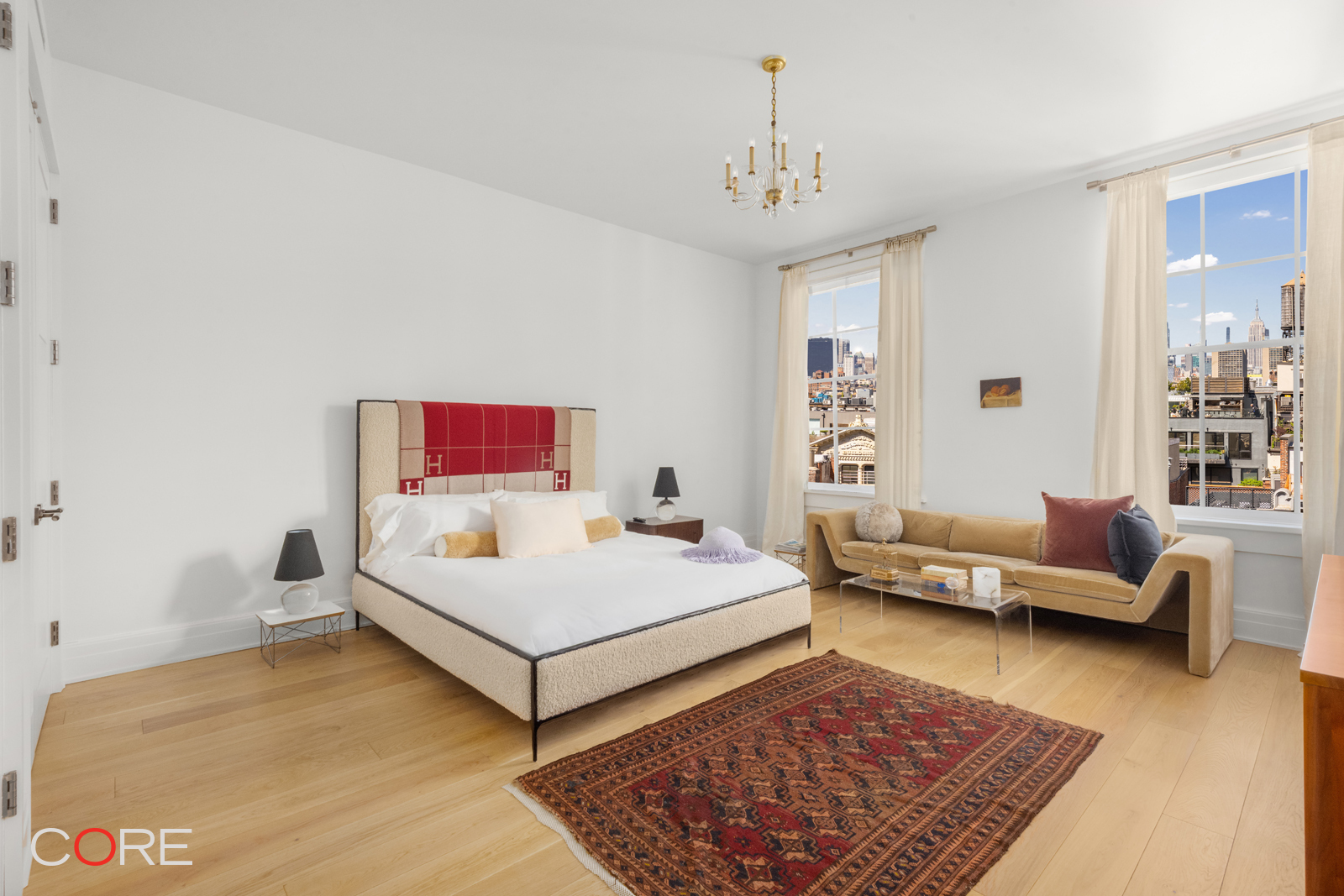 87 Leonard Street, Unit PHB Manhattan, NY 10013 - Photo 11 of 16 a bedroom with a bed and couch