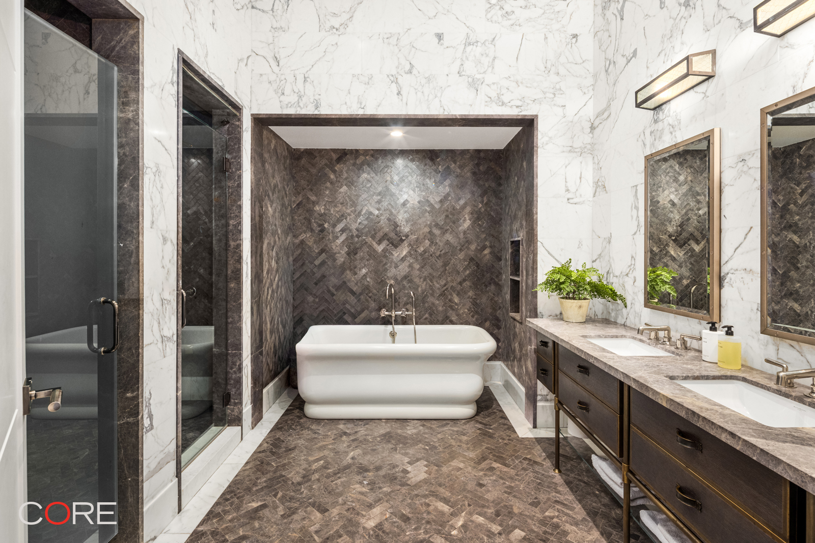87 Leonard Street, Unit PHB Manhattan, NY 10013 - Photo 12 of 16 a bathroom with a sink a toilet and shower