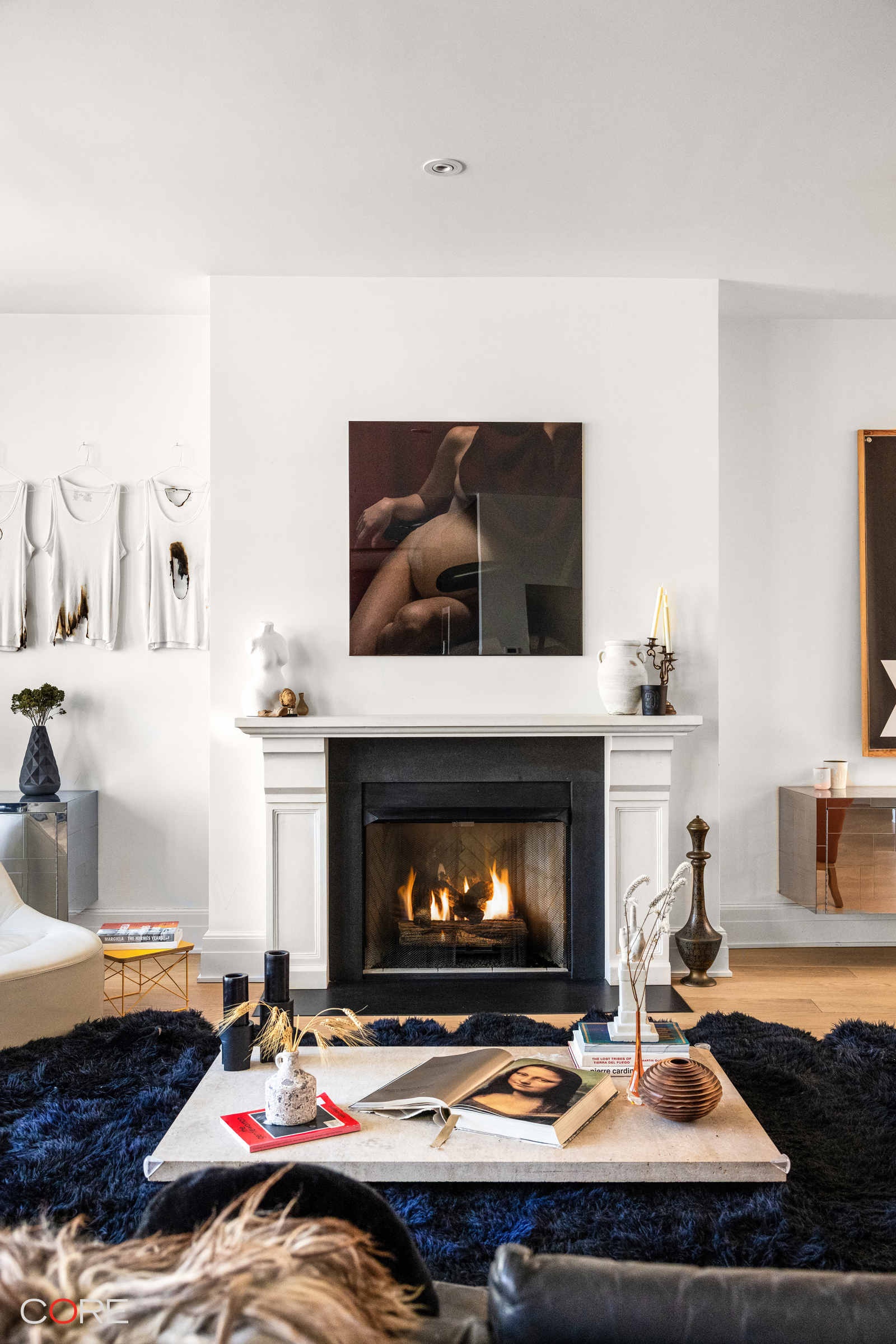 87 Leonard Street, Unit PHB Manhattan, NY 10013 - Photo 2 of 16 a living room with furniture and a fireplace