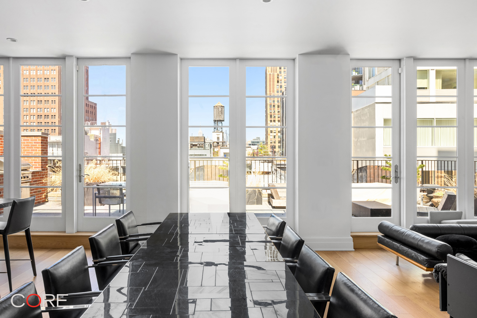 87 Leonard Street, Unit PHB Manhattan, NY 10013 - Photo 6 of 16 a living room with furniture and floor to windows