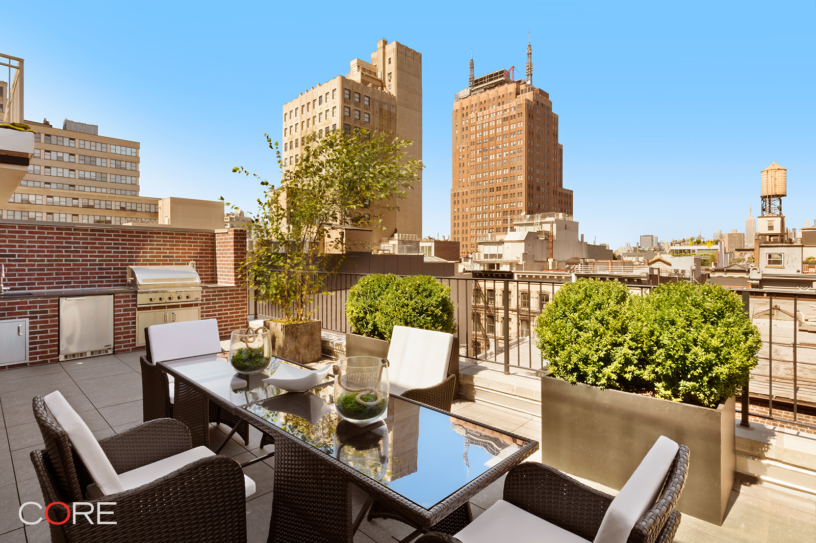 87 Leonard Street, Unit PHB Manhattan, NY 10013 - Photo 7 of 16 a view of a city from a dining room with furniture