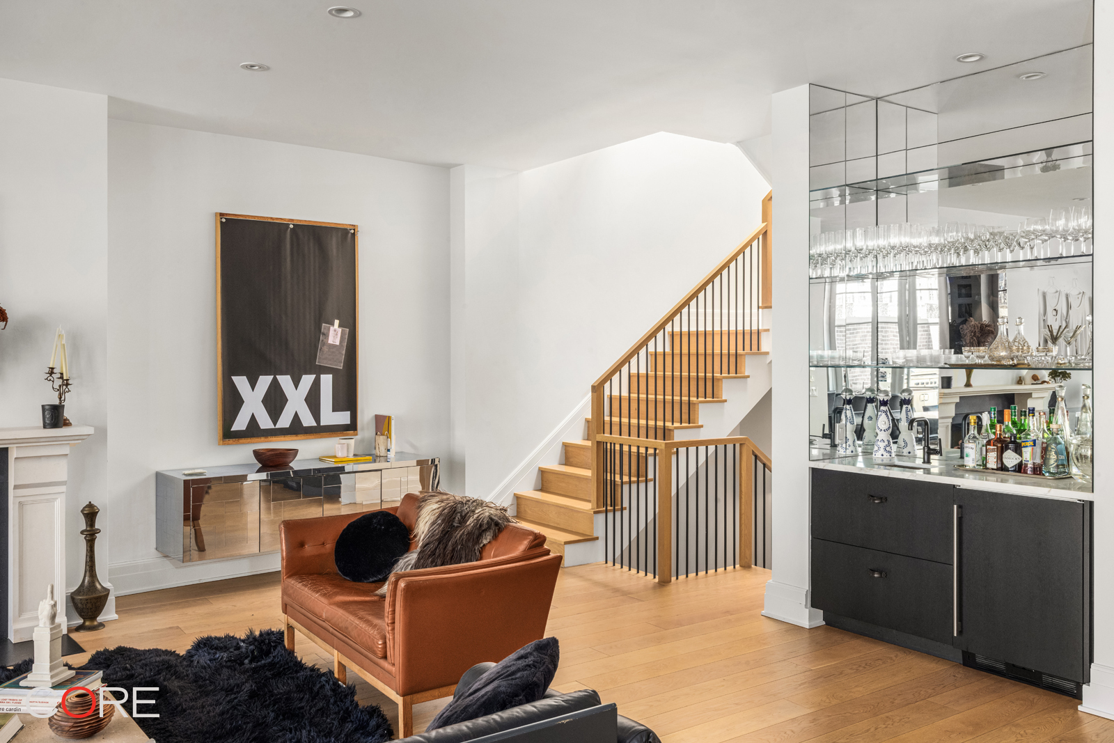 87 Leonard Street, Unit PHB Manhattan, NY 10013 - Photo 8 of 16 a living room with furniture and a wooden floor