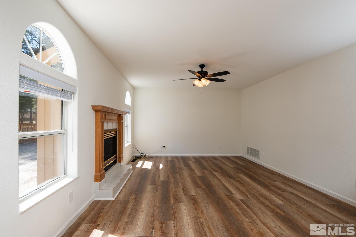 4651 Reds Grade Carson City, NV 89703 - Photo 12 of 39 wooden floor in an empty room with a window