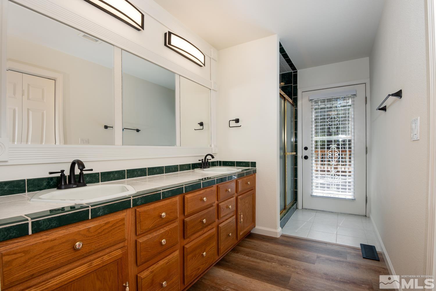 4651 Reds Grade Carson City, NV 89703 - Photo 15 of 39 a spacious bathroom with double vanity and a mirror