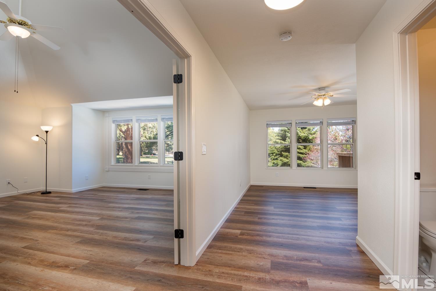 4651 Reds Grade Carson City, NV 89703 - Photo 18 of 39 a view of an empty room with wooden floor and a window