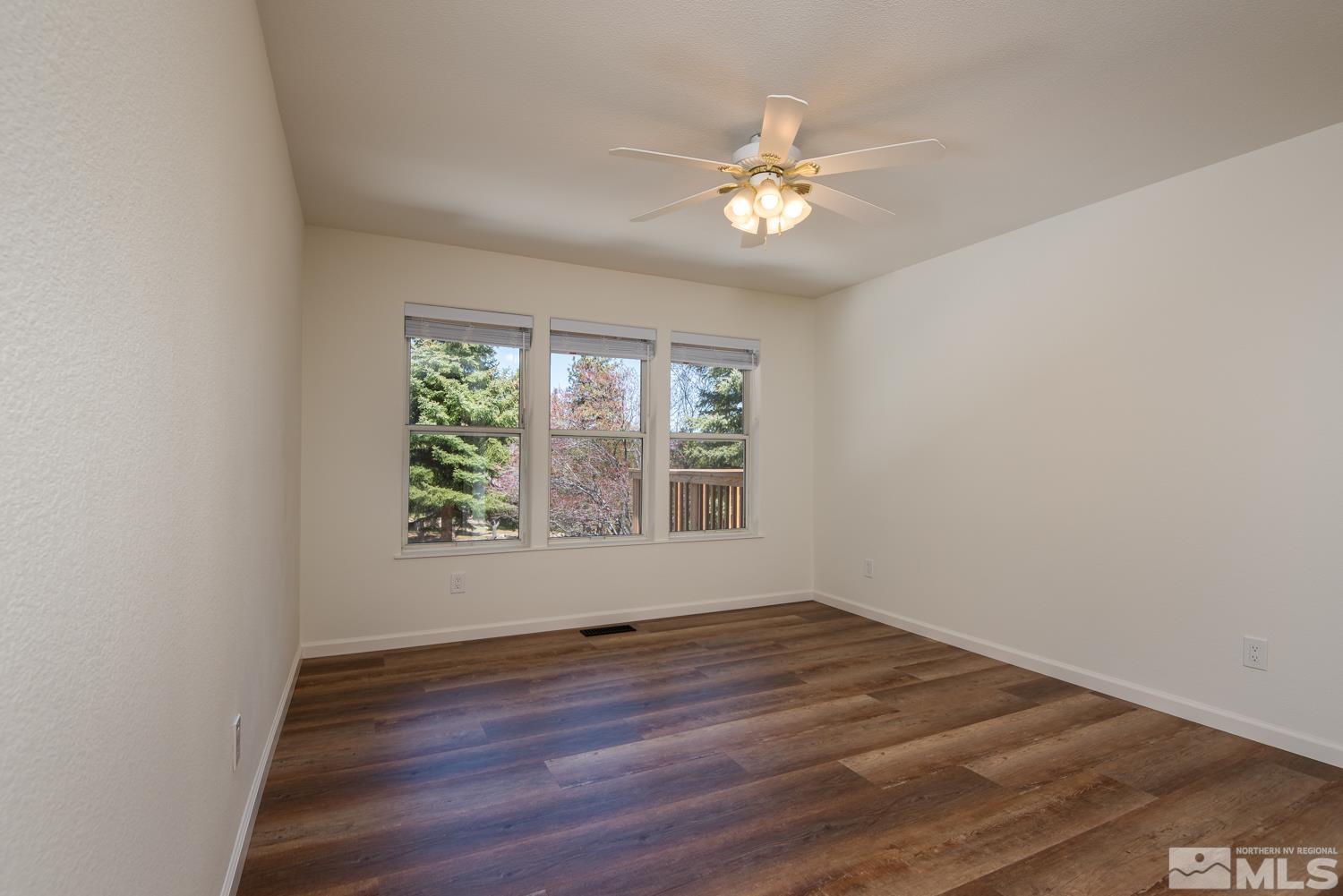 4651 Reds Grade Carson City, NV 89703 - Photo 19 of 39 a view of an empty room with wooden floor and a window
