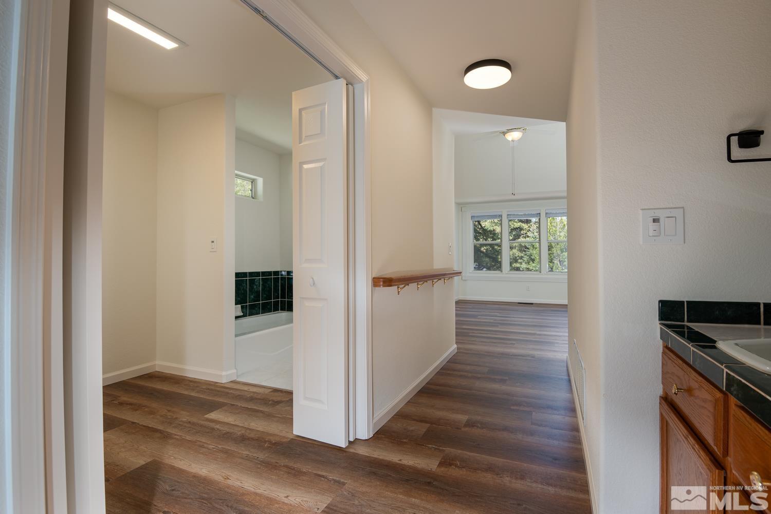 4651 Reds Grade Carson City, NV 89703 - Photo 20 of 39 a view of a hallway with wooden floor and staircase