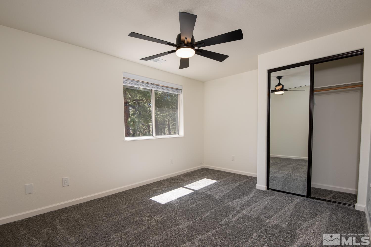 4651 Reds Grade Carson City, NV 89703 - Photo 22 of 39 an empty room with closet and windows