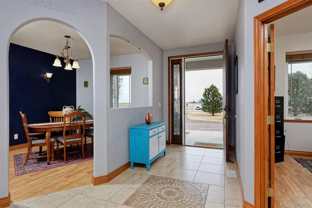 a view of a livingroom with furniture and windows