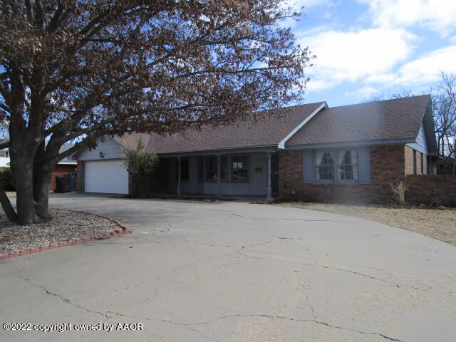 6109 Gainsborough Road Amarillo, TX 79106 - Photo 1 of 15 a front view of a house with a yard and garage