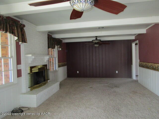 6109 Gainsborough Road Amarillo, TX 79106 - Photo 8 of 15 a view of a livingroom with a fireplace