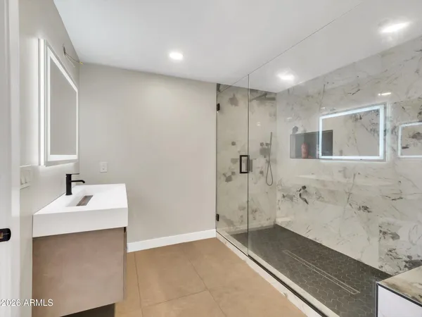 a bathroom with a sink and a mirror