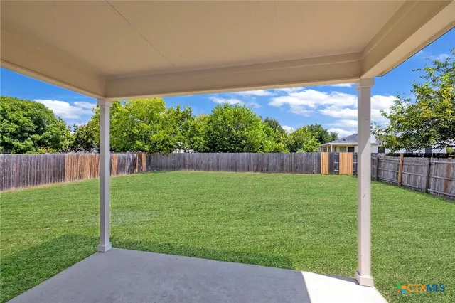 a view of a backyard with a garden