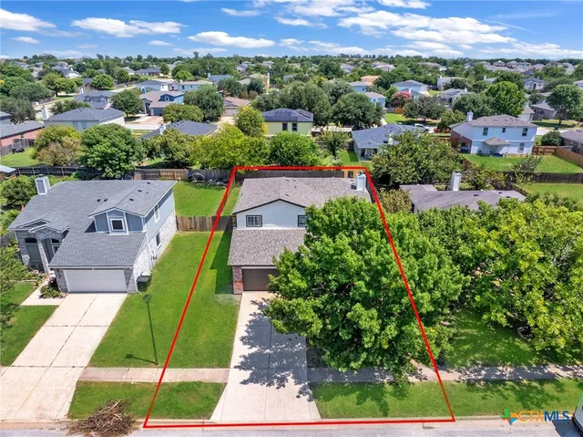 an aerial view of a house with a garden