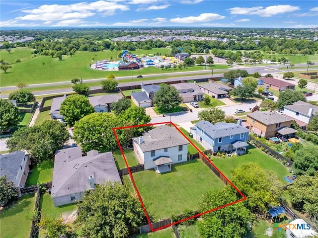 an aerial view of a house with a garden