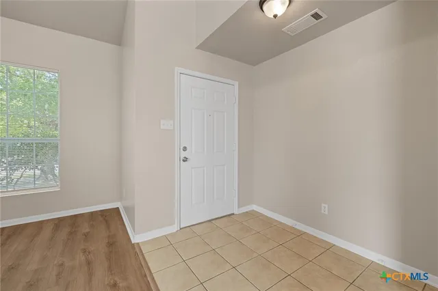 a view of an empty room and window