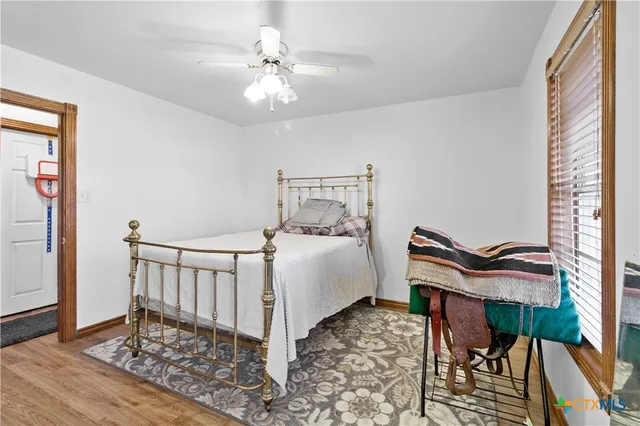 a bedroom with furniture and a chandelier
