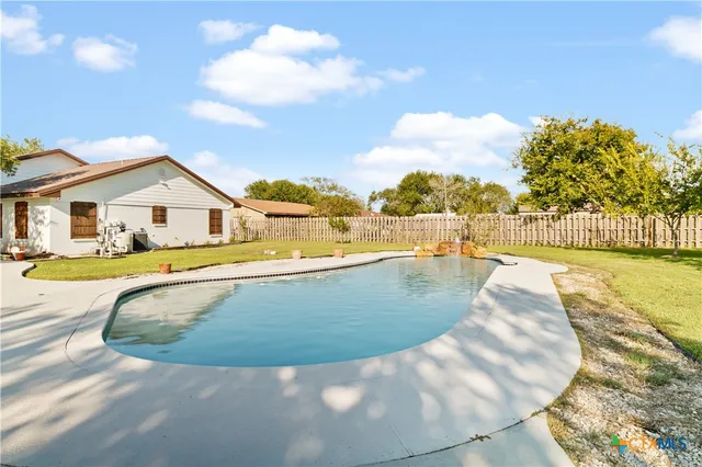 a view of outdoor space and swimming pool