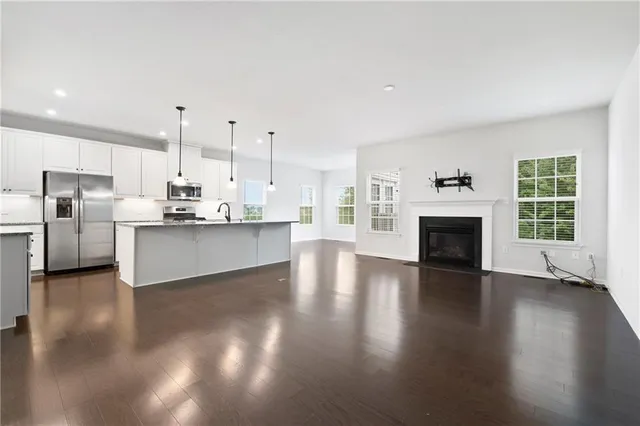 a view of kitchen with furniture and wooden floor