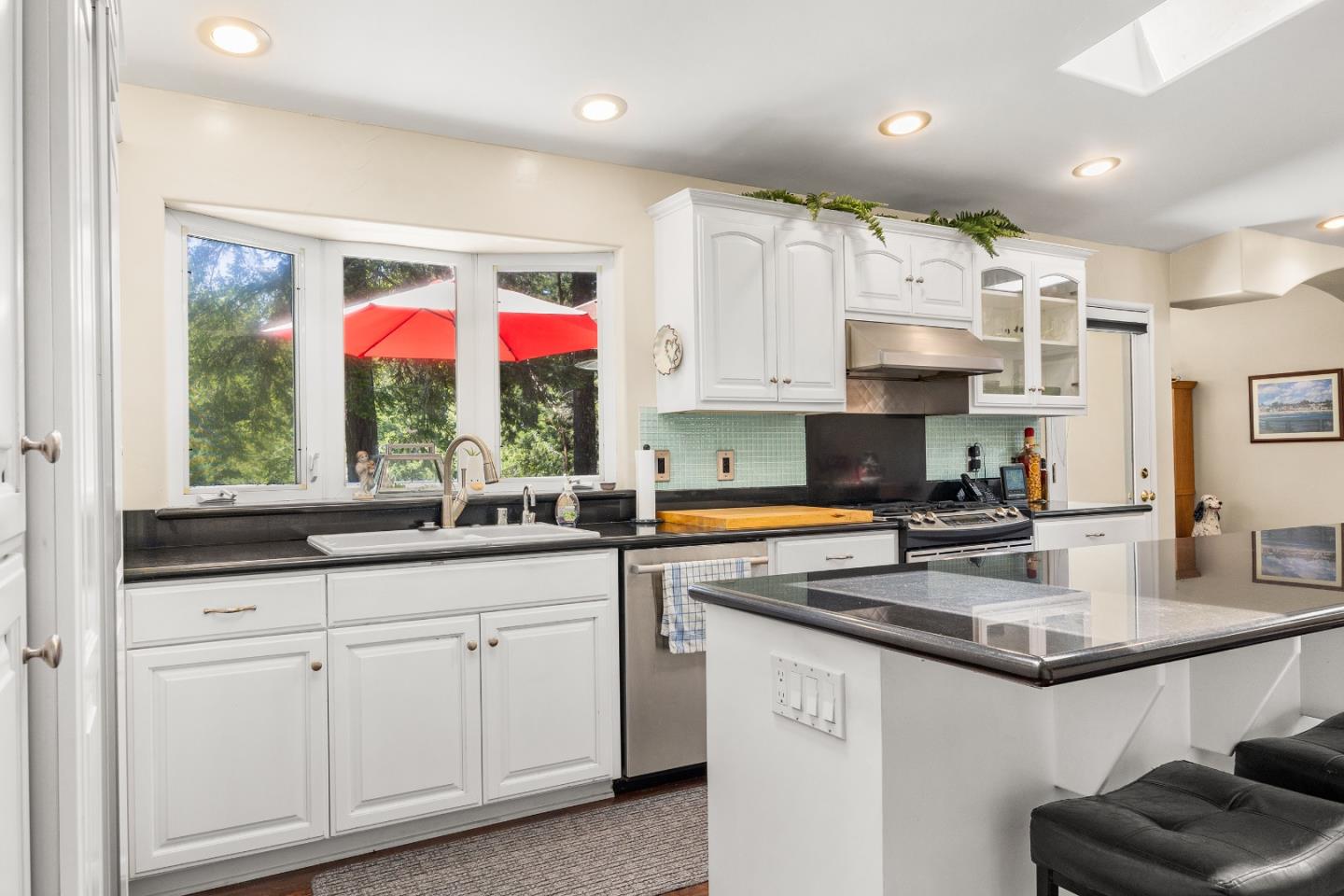 2000 Glen Canyon Road Santa Cruz, CA 95060 - Photo 10 of 41 a kitchen with granite countertop a sink a window stainless steel appliances and cabinets