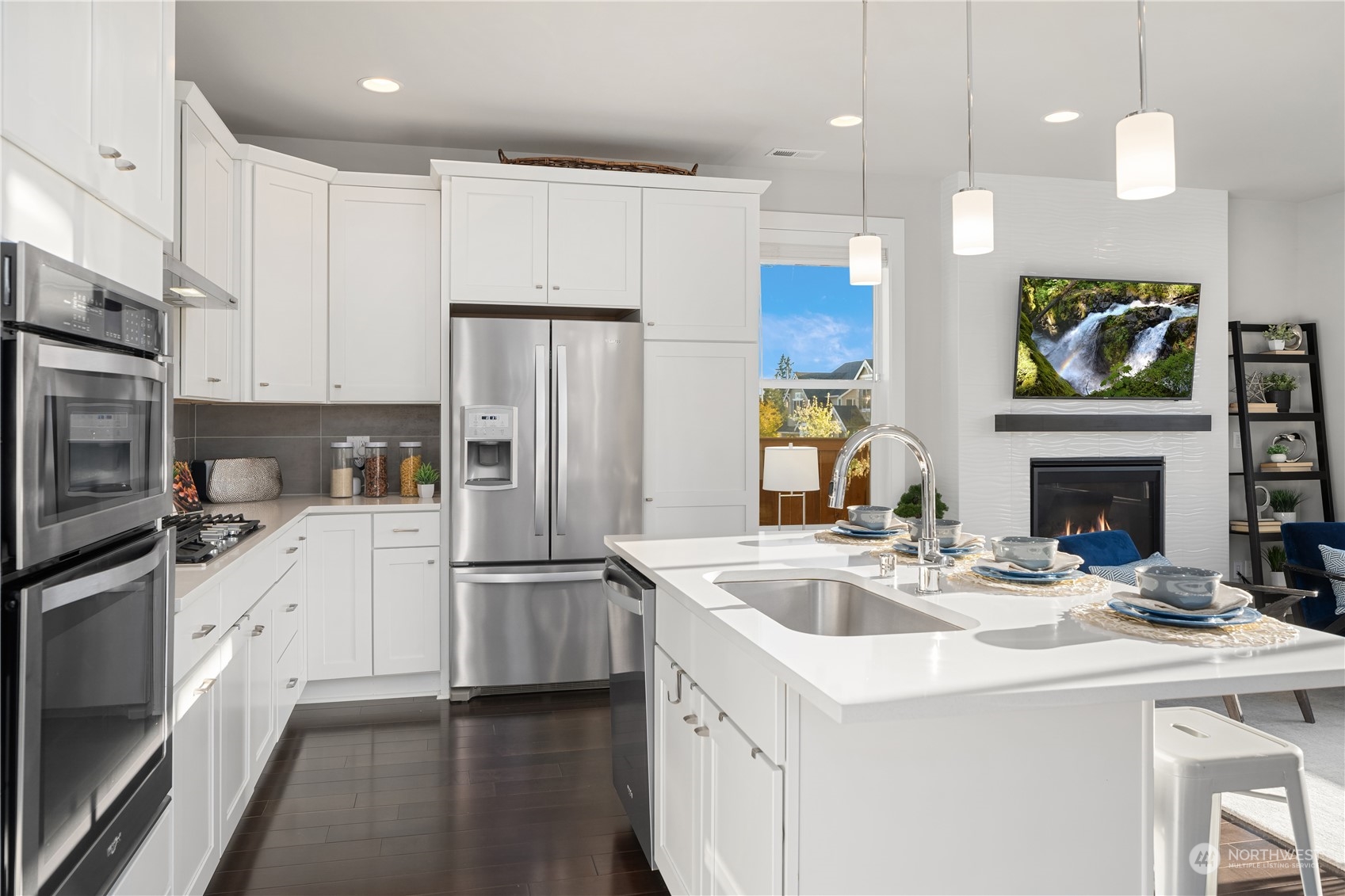 4312 224th Place Southeast Bothell, WA 98021 - Photo 12 of 40 a kitchen with a sink stainless steel appliances and white cabinets