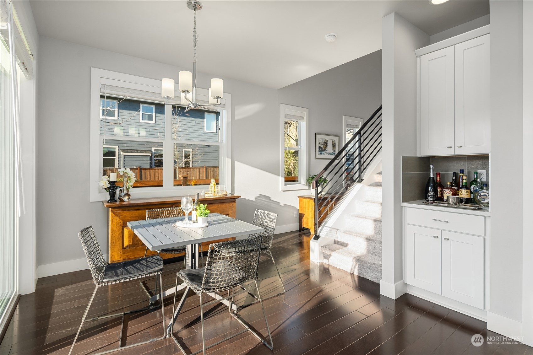 4312 224th Place Southeast Bothell, WA 98021 - Photo 15 of 40 a view of a dining room with furniture wooden floor and chandelier