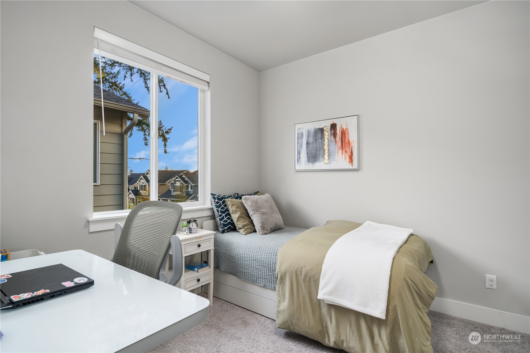 4312 224th Place Southeast Bothell, WA 98021 - Photo 24 of 40 a bedroom with a bed and a painting on the wall