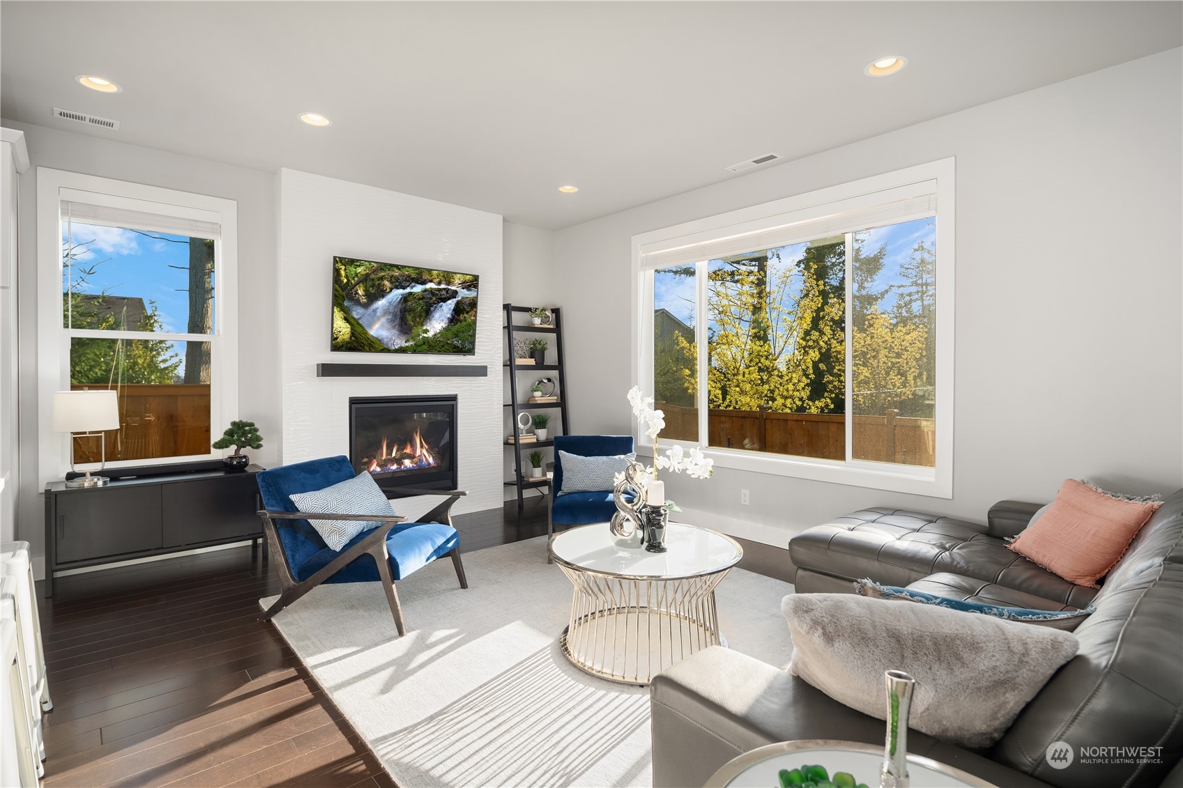 4312 224th Place Southeast Bothell, WA 98021 - Photo 6 of 40 a living room with furniture two window and a fireplace