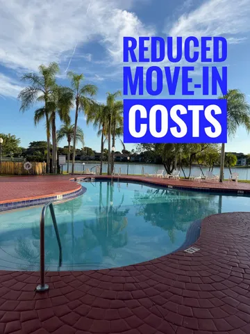 a swimming pool with outdoor seating and yard