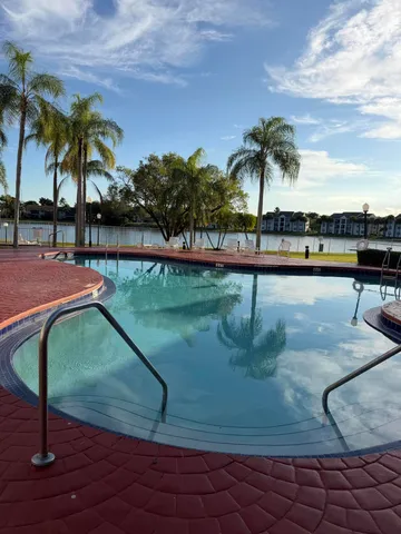 a swimming pool with an outdoor seating