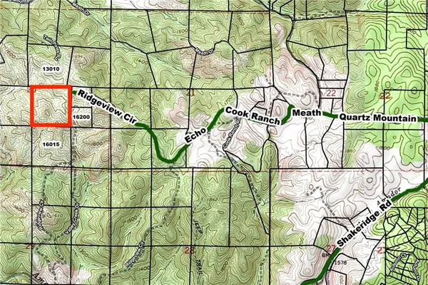 a view of a road with trees in the background