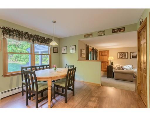 19 Justice Hill Road Sterling, MA 01564 - Photo 12 of 30 a view of a dining room with furniture window and wooden floor