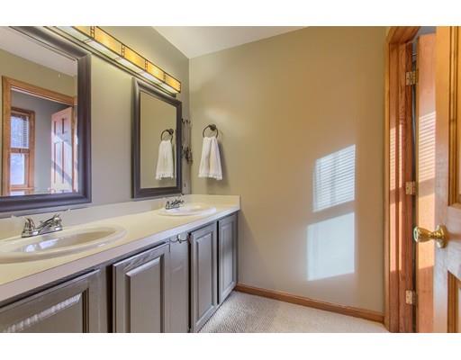19 Justice Hill Road Sterling, MA 01564 - Photo 18 of 30 a bathroom with a granite countertop sink and a mirror