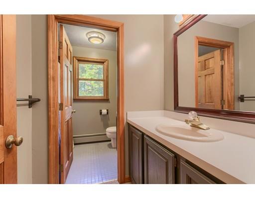 19 Justice Hill Road Sterling, MA 01564 - Photo 22 of 30 a bathroom with a sink a toilet and a mirror
