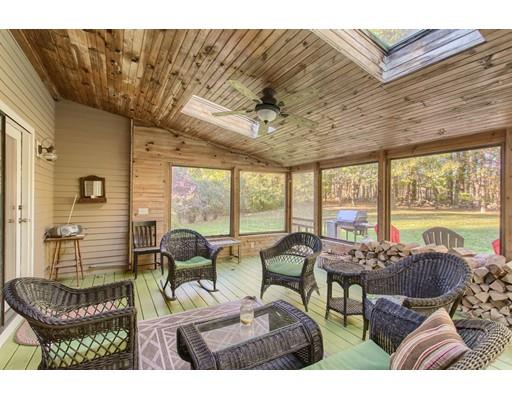 19 Justice Hill Road Sterling, MA 01564 - Photo 24 of 30 a view of a dining room with furniture large windows and wooden floor