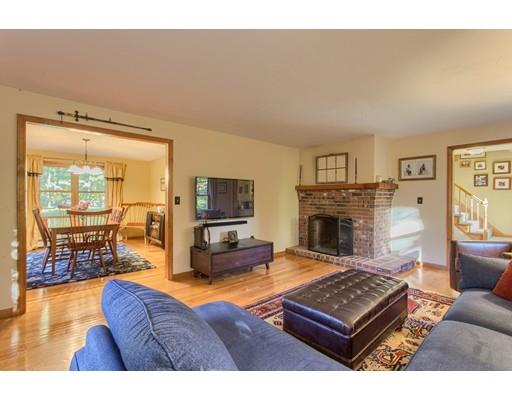 19 Justice Hill Road Sterling, MA 01564 - Photo 5 of 30 a living room with furniture a flat screen tv and a fireplace