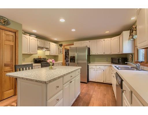 19 Justice Hill Road Sterling, MA 01564 - Photo 9 of 30 a kitchen with a sink a stove a refrigerator and cabinets
