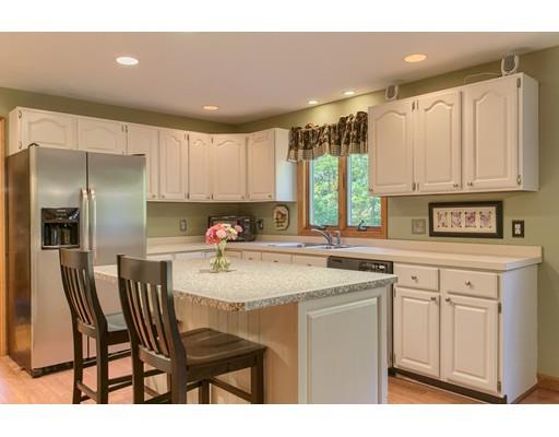19 Justice Hill Road Sterling, MA 01564 - Photo 10 of 30 a kitchen with kitchen island granite countertop a sink cabinets and window