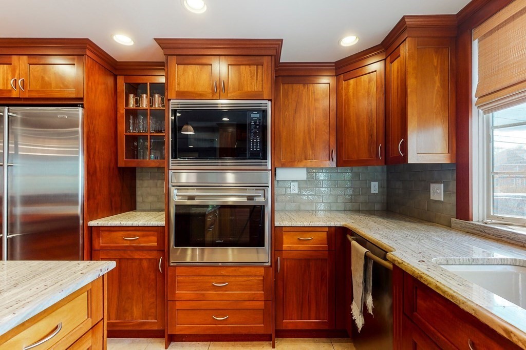 9 Mellen Street Needham, MA 02494 - Photo 16 of 42 a kitchen with stainless steel appliances granite countertop a refrigerator and a sink