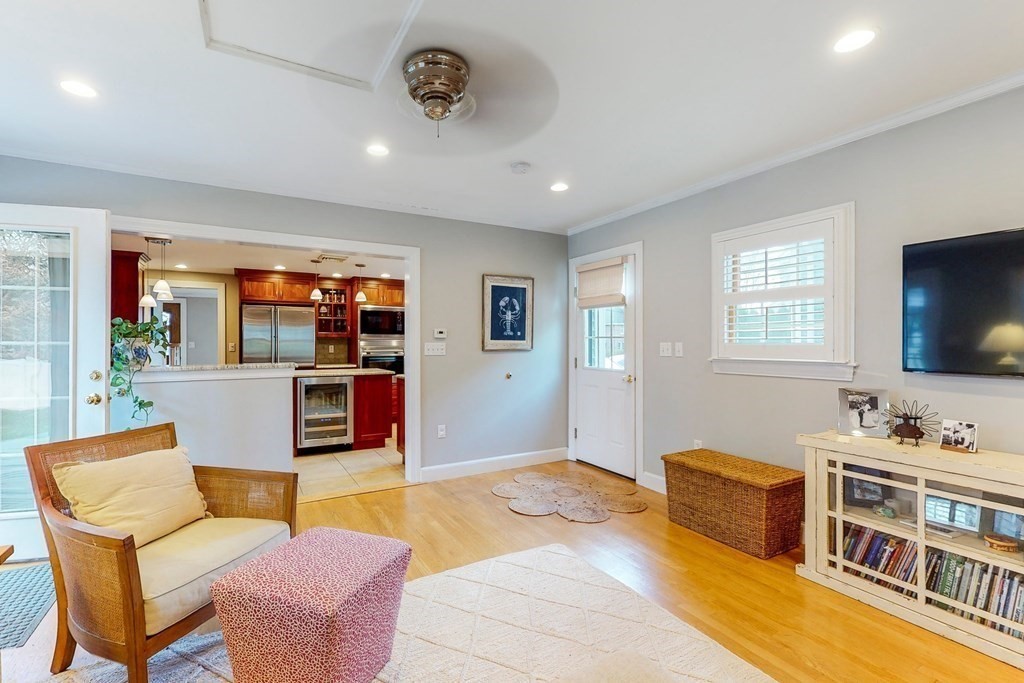 9 Mellen Street Needham, MA 02494 - Photo 18 of 42 a living room with furniture and a flat screen tv