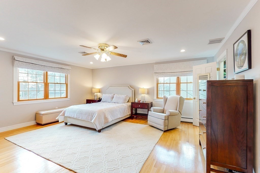 9 Mellen Street Needham, MA 02494 - Photo 23 of 42 a spacious bedroom with a bed and window