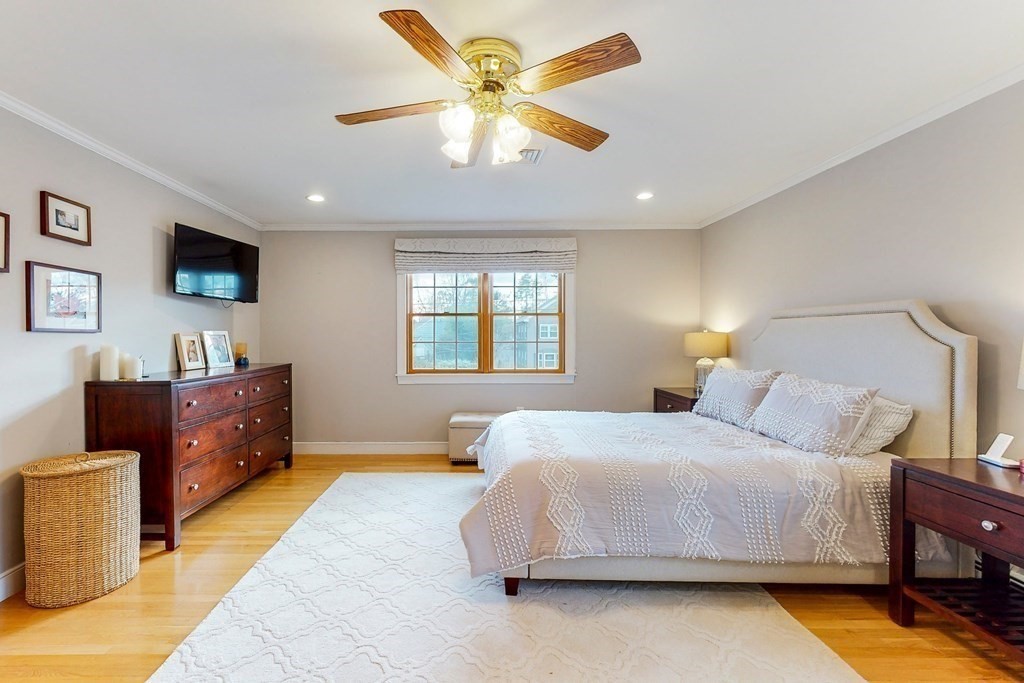 9 Mellen Street Needham, MA 02494 - Photo 24 of 42 a bedroom with a bed and a flat screen tv