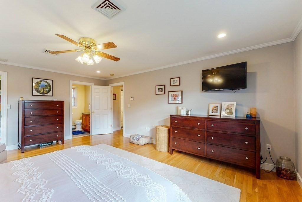 9 Mellen Street Needham, MA 02494 - Photo 25 of 42 a bedroom with a bed and a flat screen tv