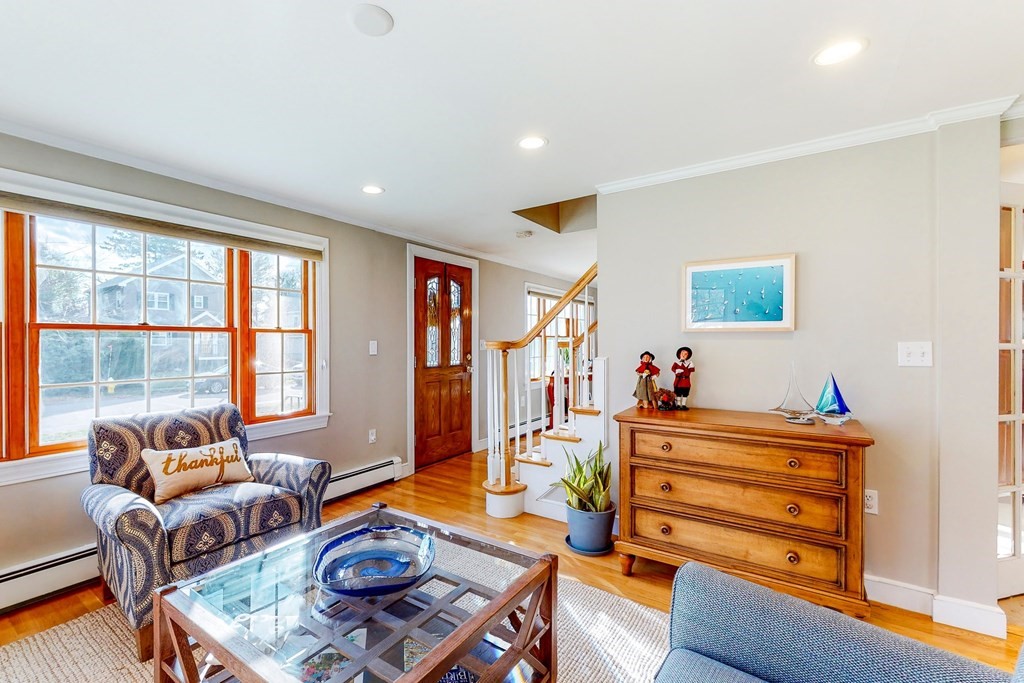 9 Mellen Street Needham, MA 02494 - Photo 3 of 42 a living room with furniture a flat screen tv and a window