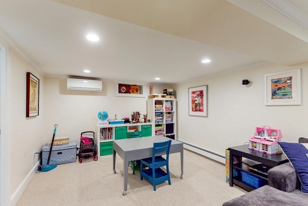 9 Mellen Street Needham, MA 02494 - Photo 33 of 42 a living room with furniture and a wooden floor