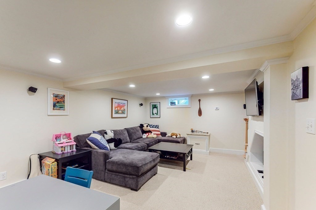 9 Mellen Street Needham, MA 02494 - Photo 34 of 42 a living room with furniture and a flat screen tv