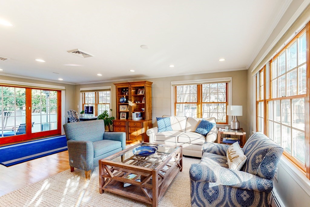 9 Mellen Street Needham, MA 02494 - Photo 4 of 42 a living room with furniture and large windows