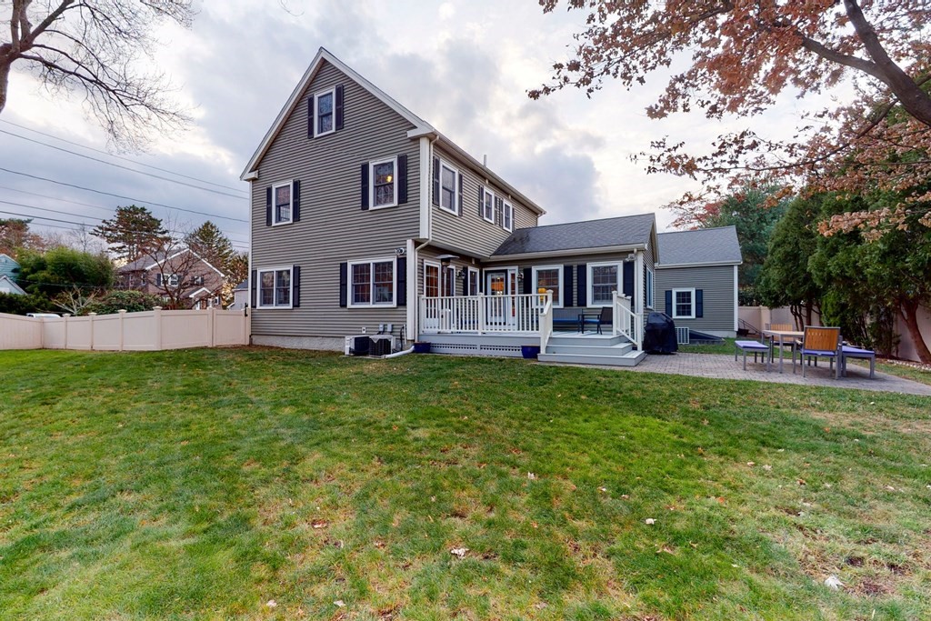 9 Mellen Street Needham, MA 02494 - Photo 42 of 42 a front view of house with yard and green space