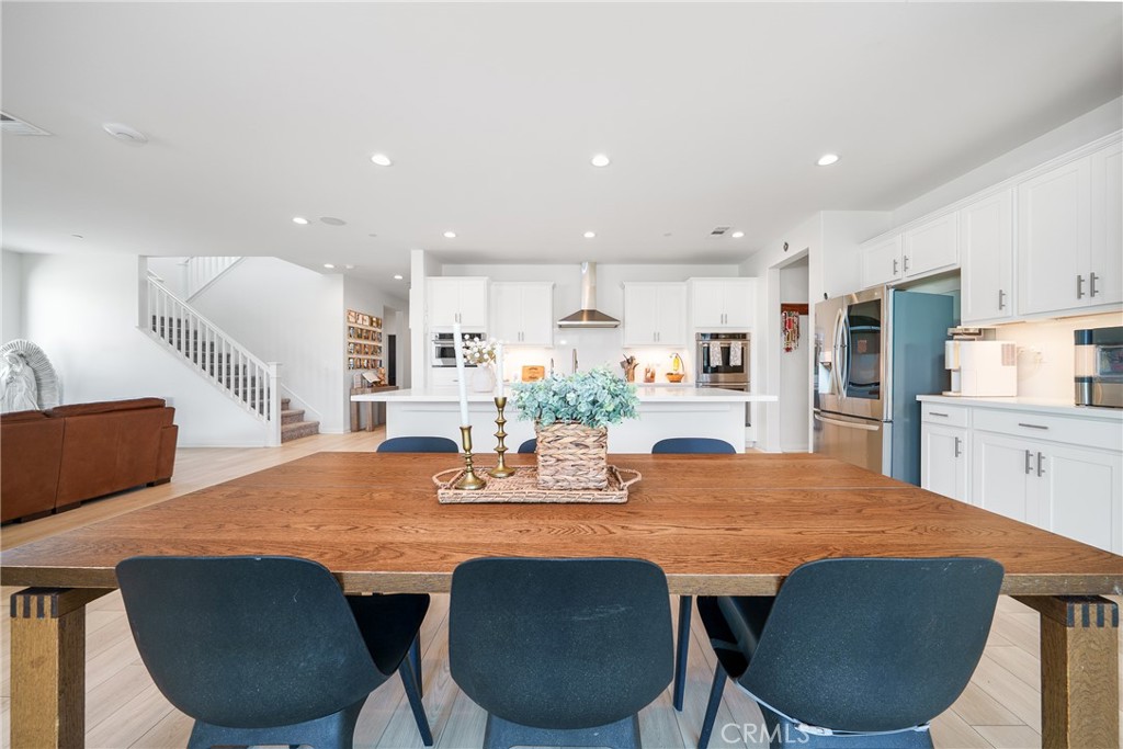 12829 Stags Leap Drive Riverside, CA 92503 - Photo 16 of 54 a dining room with furniture and window