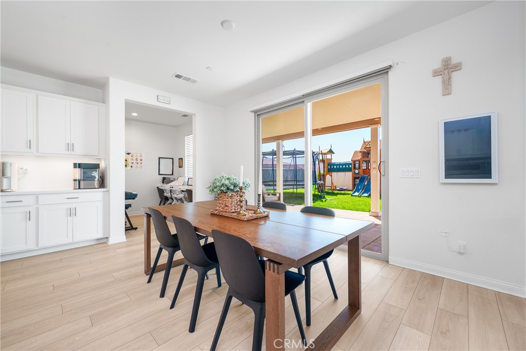 12829 Stags Leap Drive Riverside, CA 92503 - Photo 17 of 54 a view of a dining room with furniture and a window
